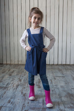 Denim apron dress, full length view
