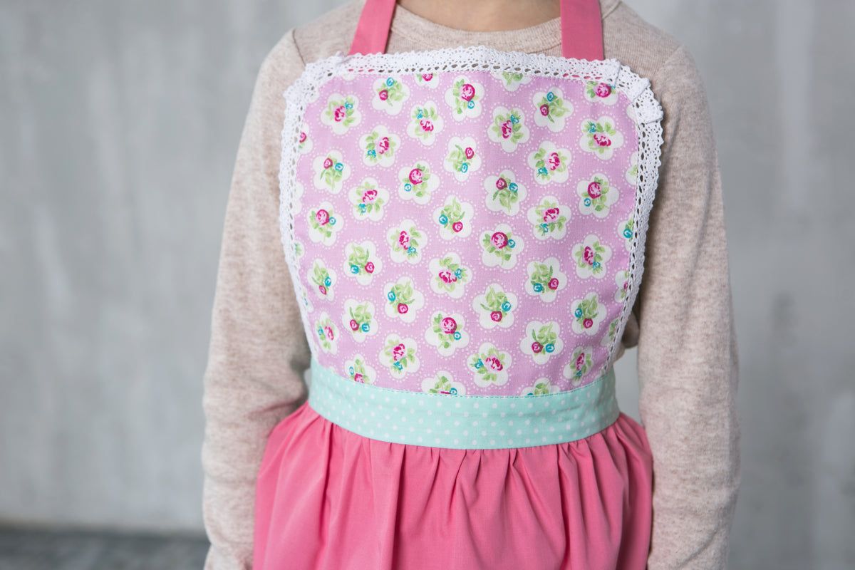 Matching family lace aprons, styled