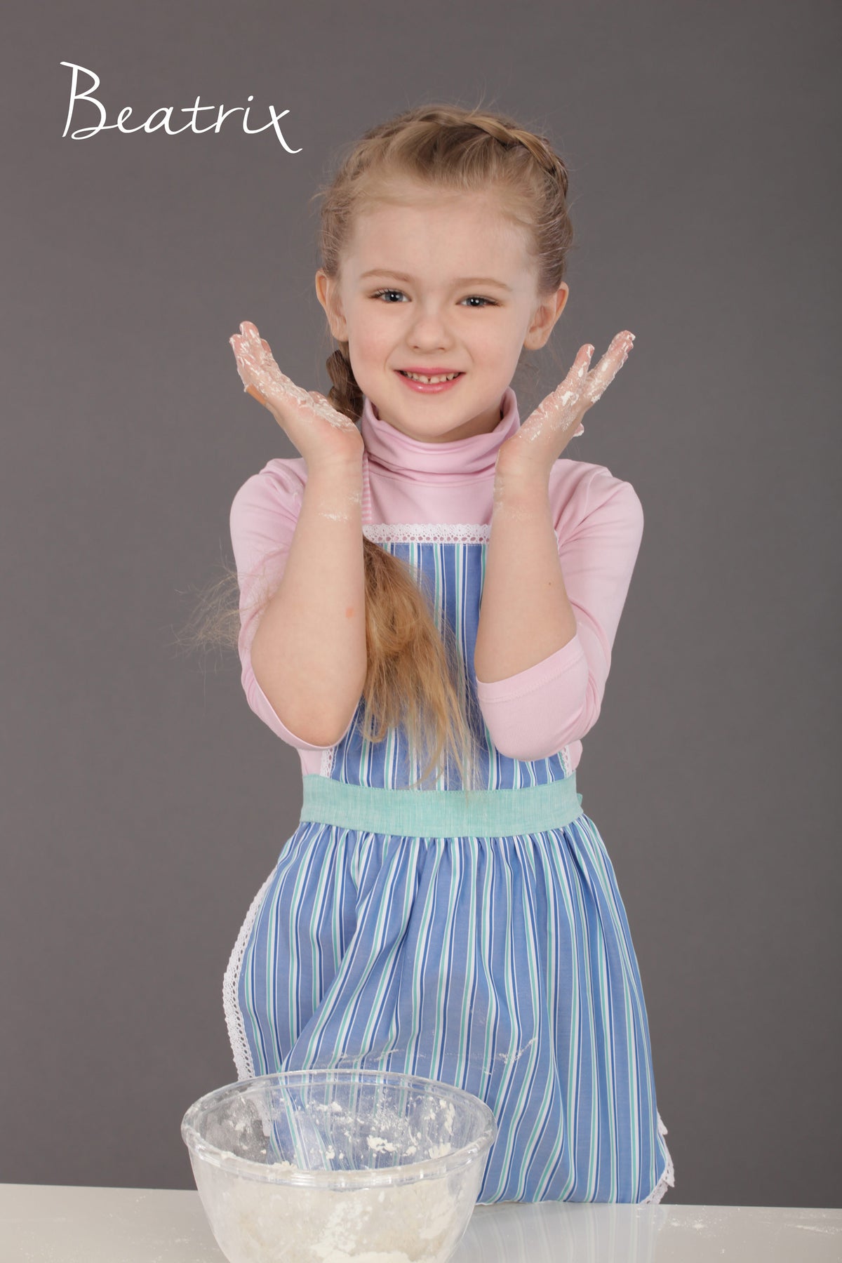 Kids lace apron worn while baking