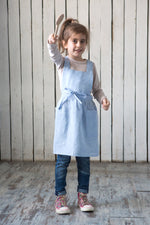Blue linen pinafore apron, front view
