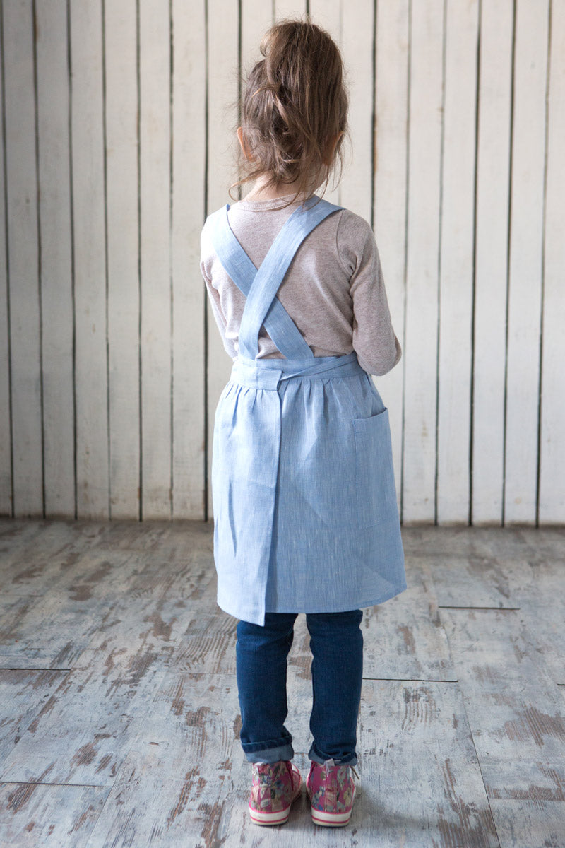 Blue linen apron, cross back strap detail
