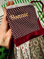 Baby and toddler aprons folded, personalised keepsake gift