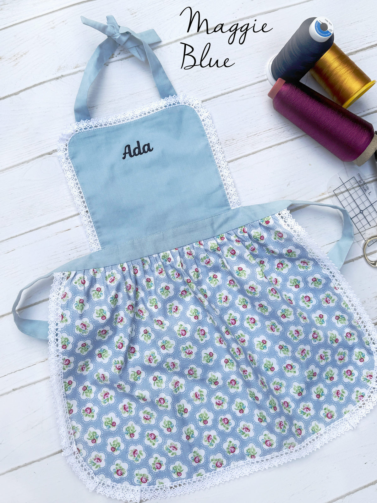 Personalised girls apron with an embroidered name, Maggie Blue