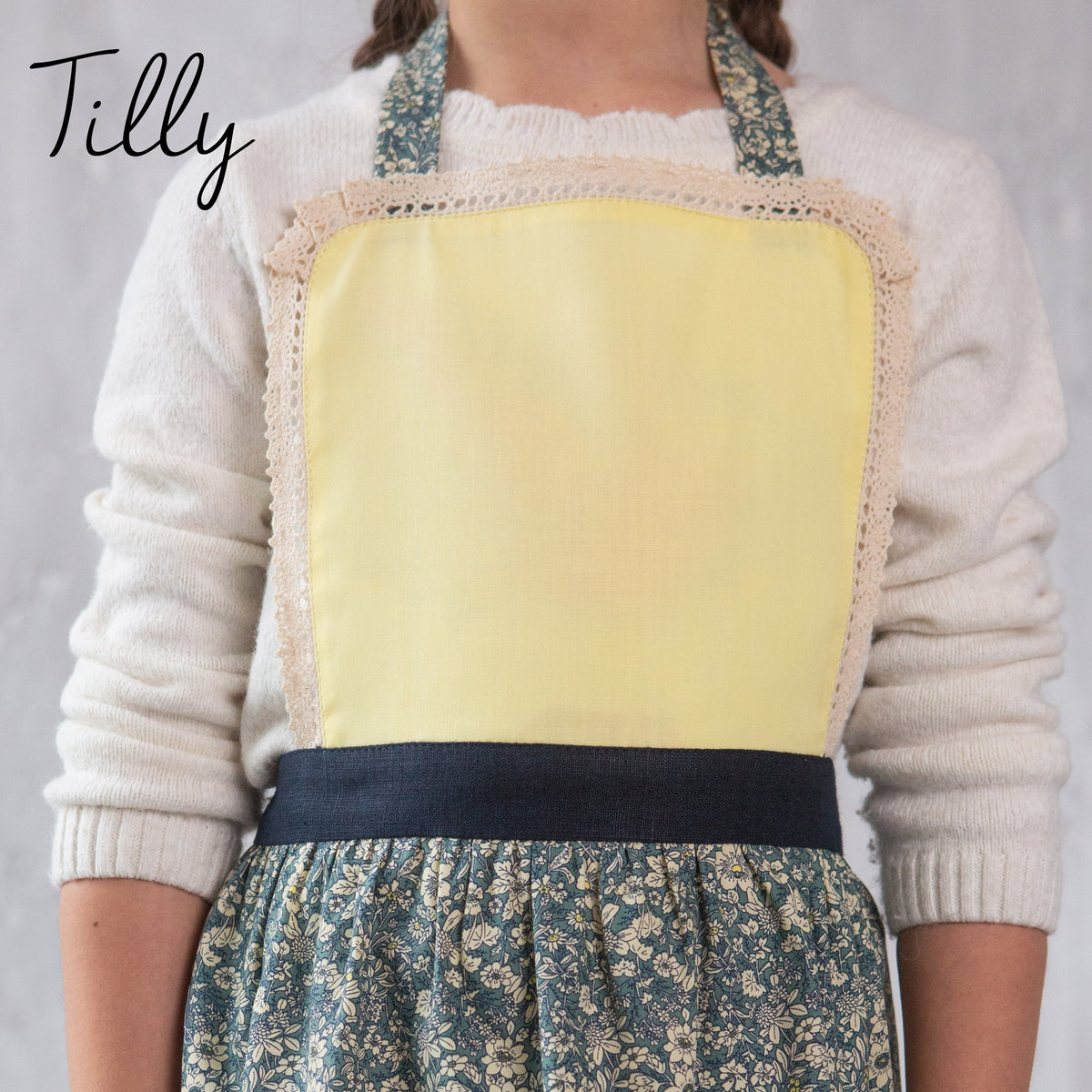 Tilly kids apron with lace trim, front view