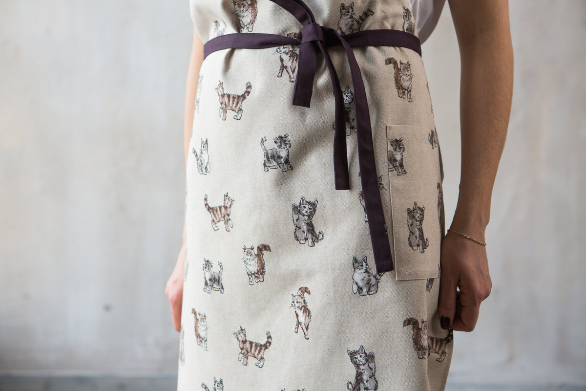 Cat print apron on child, cotton canvas