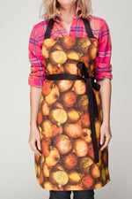 Orange pomegranate print cotton apron, front view