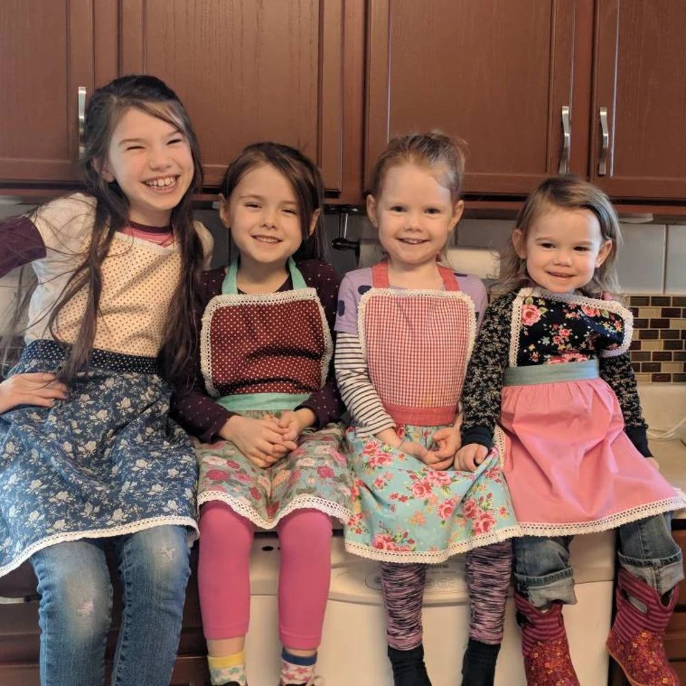 Customer photo, four sisters in matching lace aprons