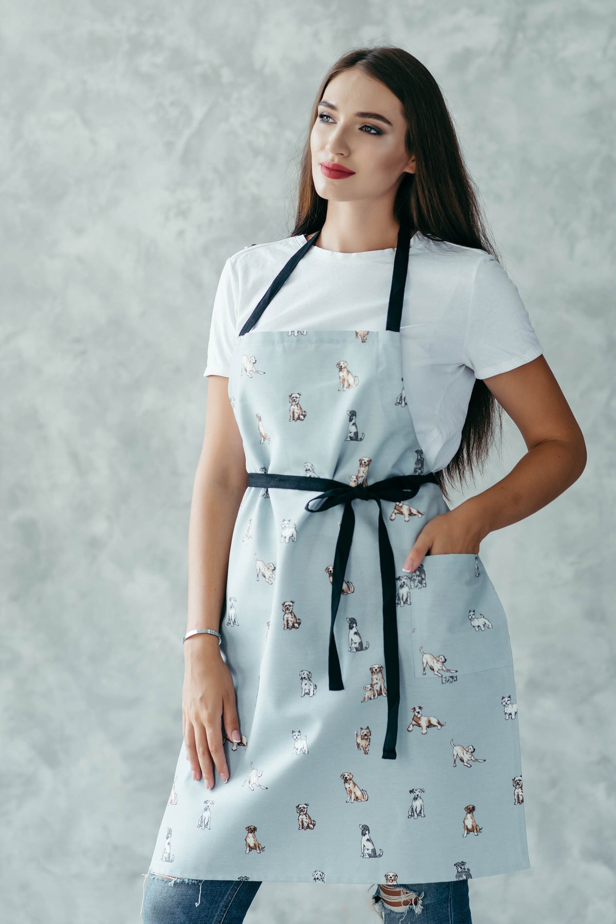 Dog print kids apron in blush, front view