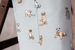 Dog print kids apron, pocket and print detail