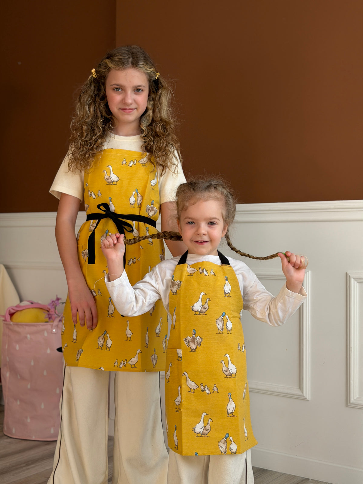 Duck print kids apron, adjustable strap detail