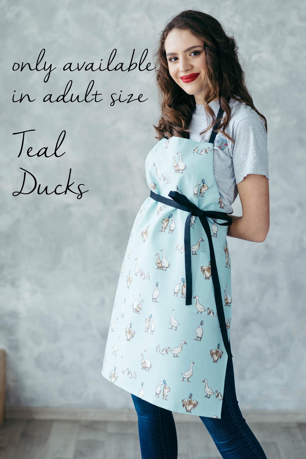 Yellow duck print kids apron, styled