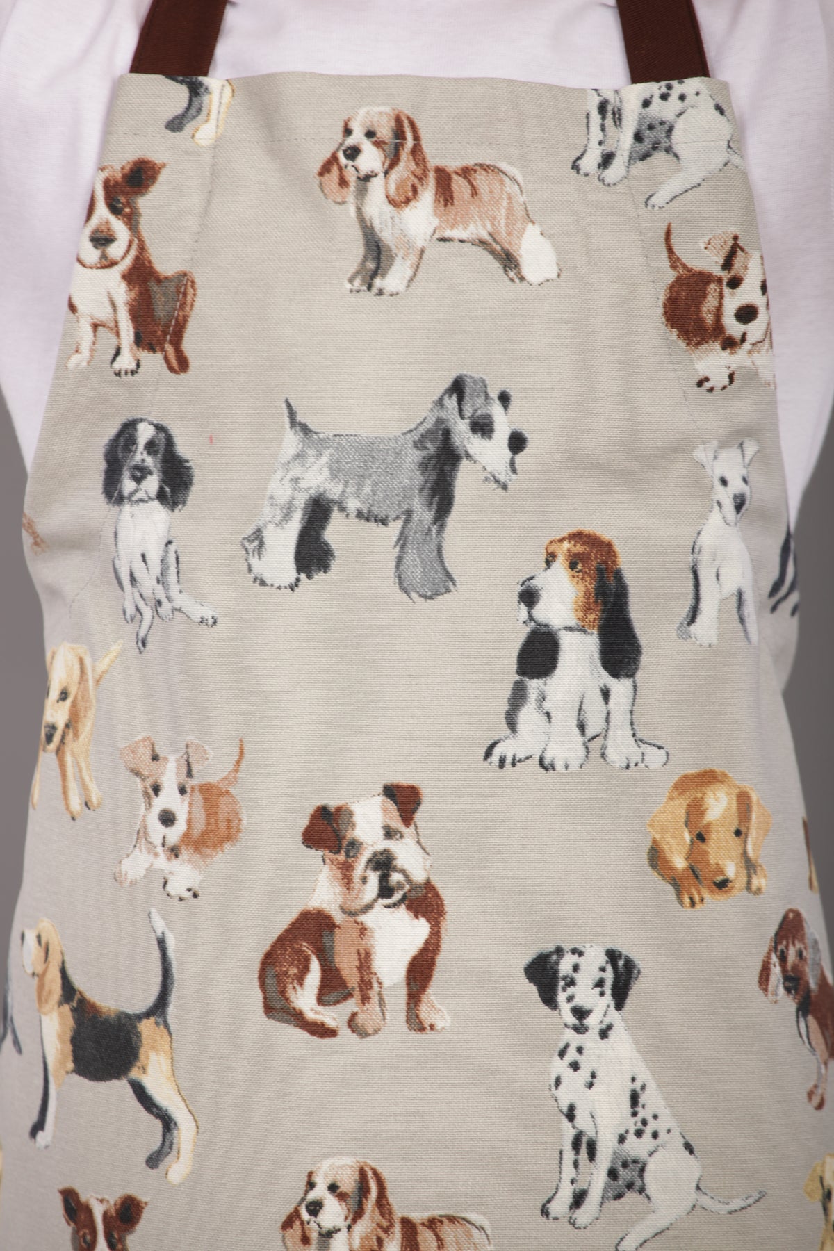Grey cat print kids apron worn by a child