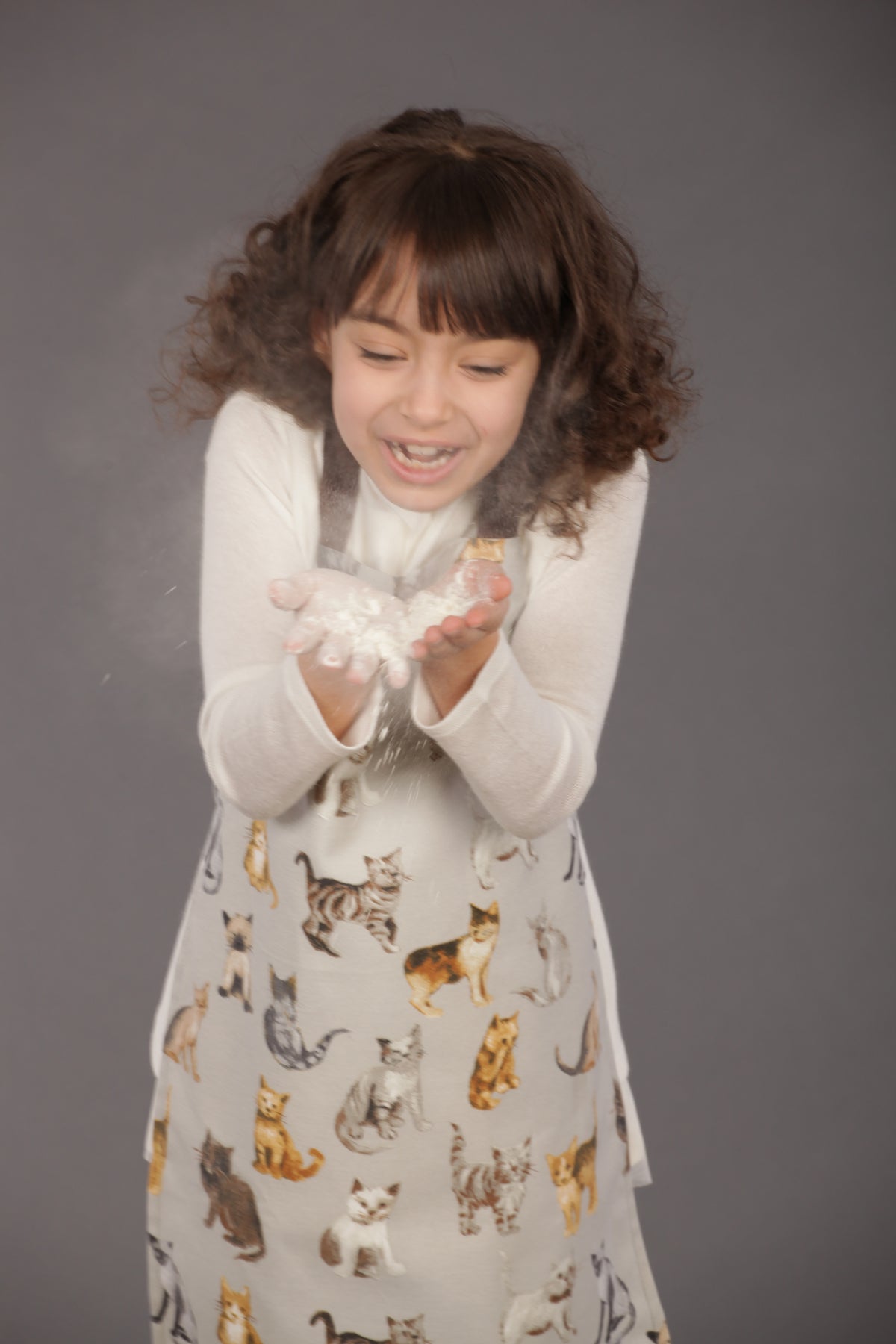 Dog print kids apron in grey, back view showing ties