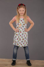 Beige strawberry print apron, full front view