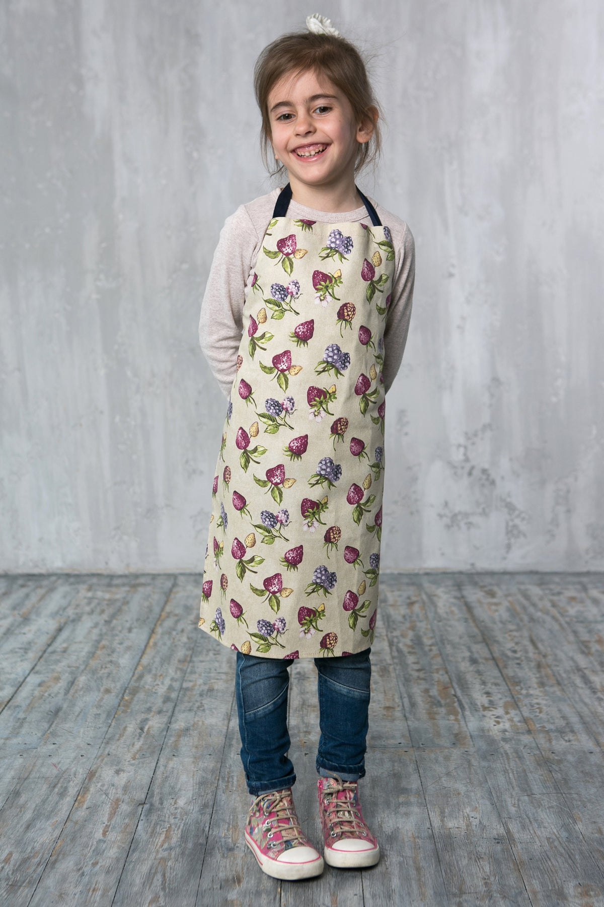 Duck egg strawberry print apron in adult size, styled