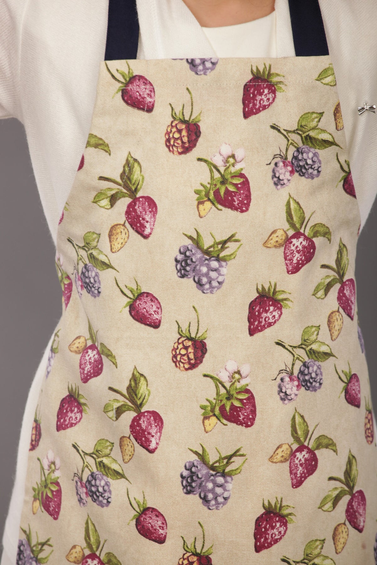 Kids strawberry print apron worn while baking