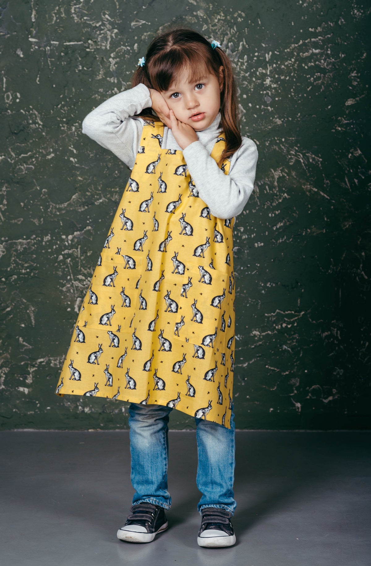Kids pinafore apron, cross back styled on a child