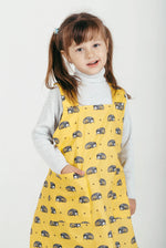 Childrens pinafore apron worn while baking