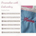 Pink printed lace apron on a toddler