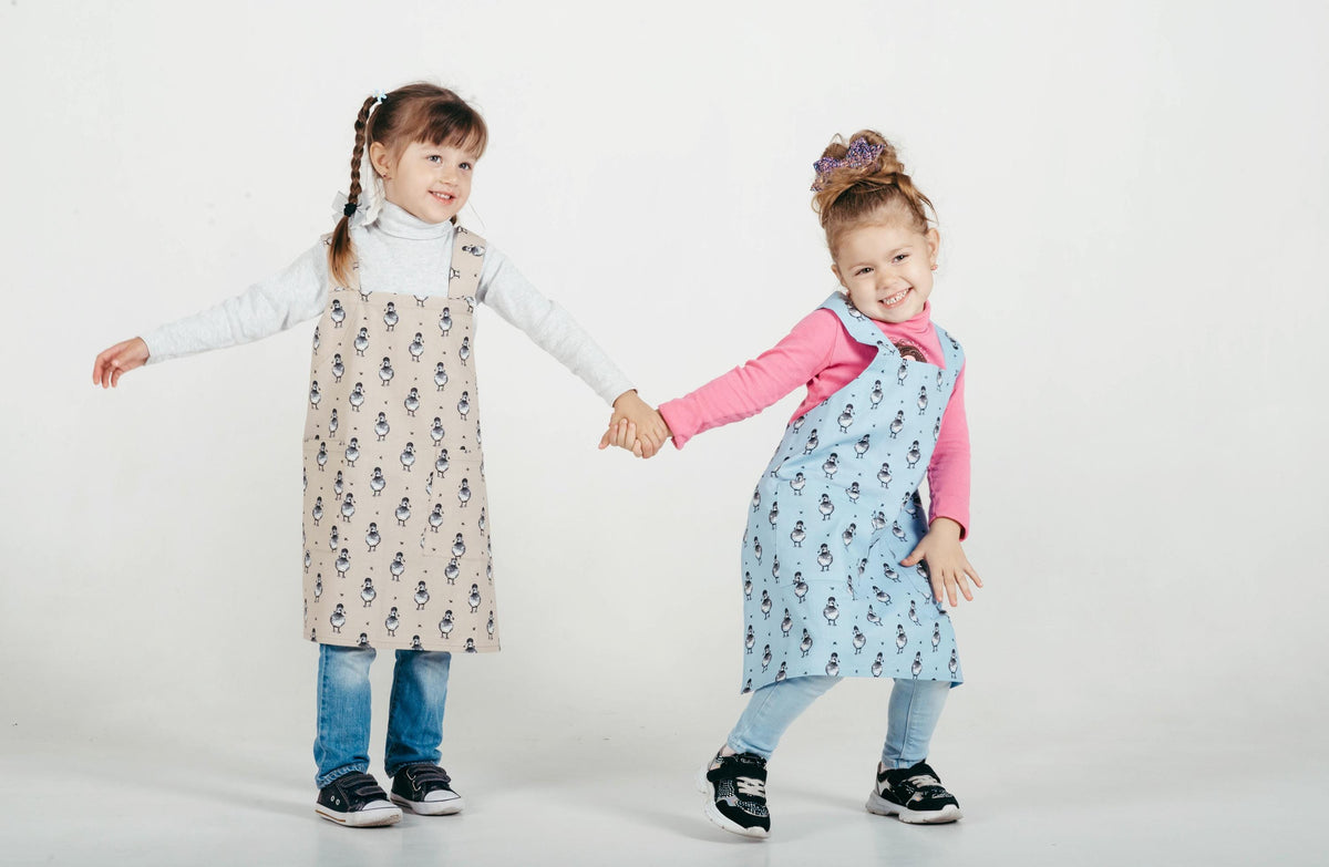 Kids pinafore apron in a printed cotton colourway