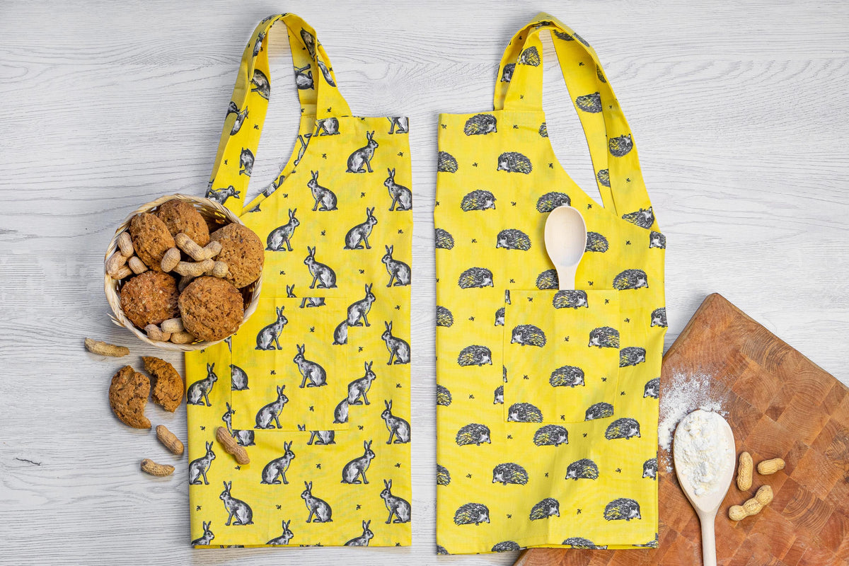 Toddler pinafore apron worn while baking