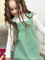 Kids craft apron in green stripe, styled