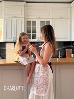 Lace apron in red, waist tie detail