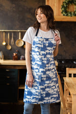 Blue polka dot apron for women, worn in the kitchen