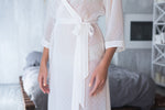 Close view of the textured dot chiffon in ivory