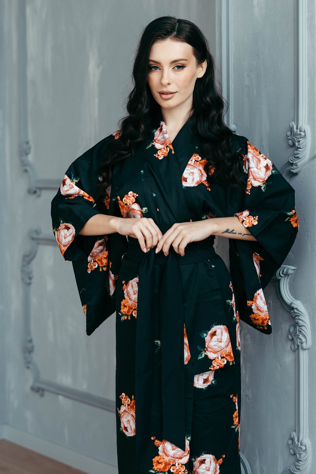 Traditional kimono for women in black floral cotton satin, worn with obi belt