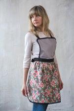 Vintage style lace apron for women, worn in the kitchen