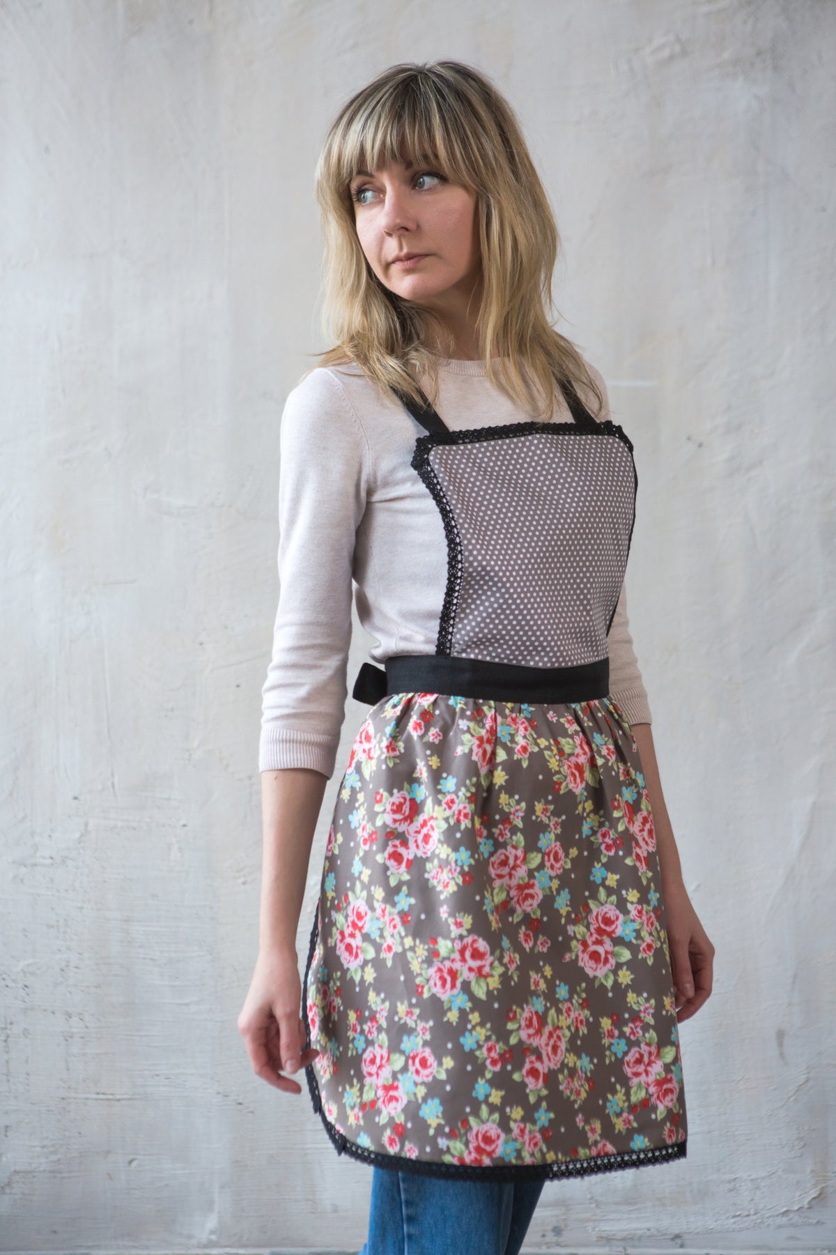 Vintage style lace apron for women, worn in the kitchen