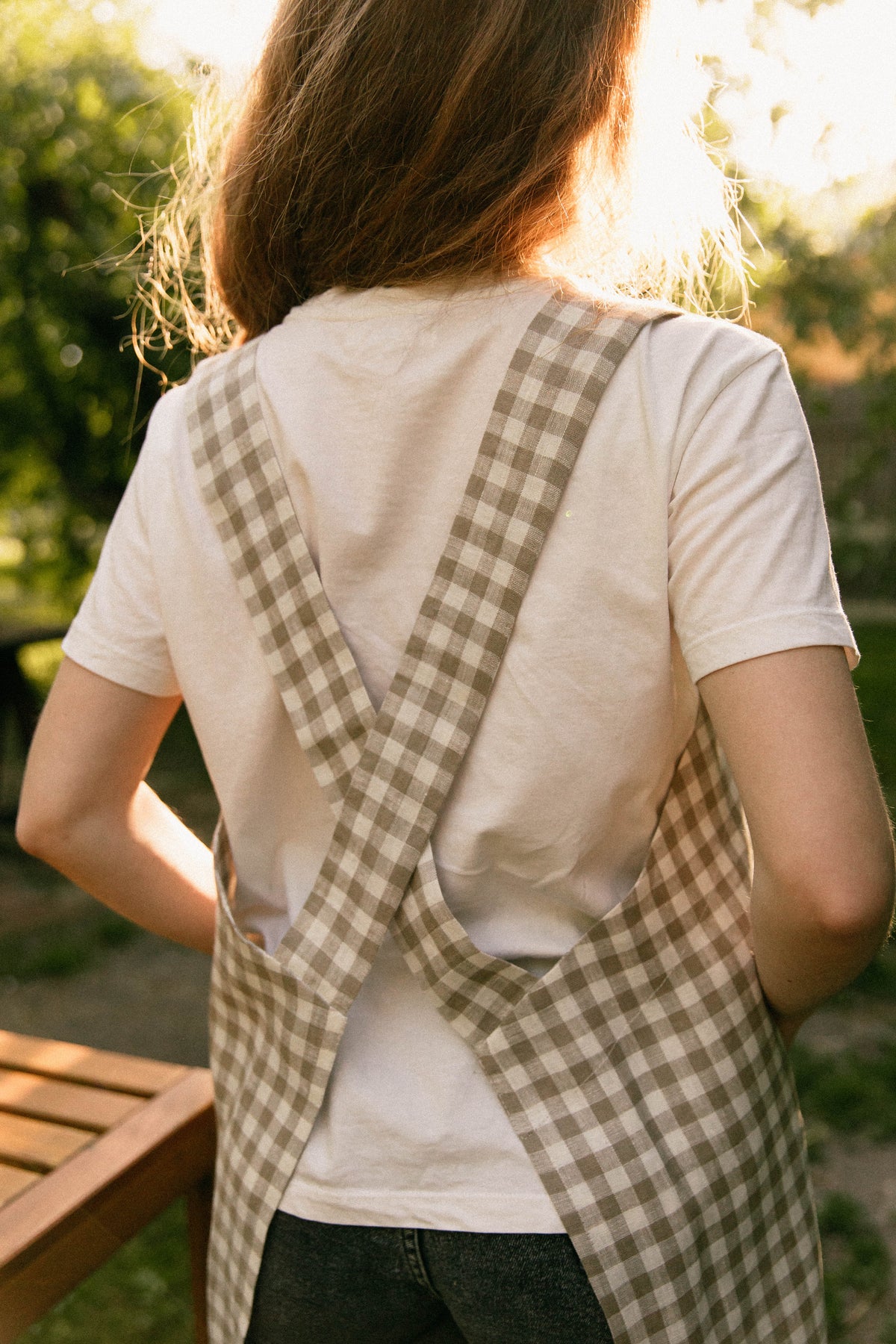 Checked linen pinafore apron, front view