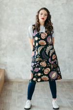 Pinafore apron styled on model, wine tapestry