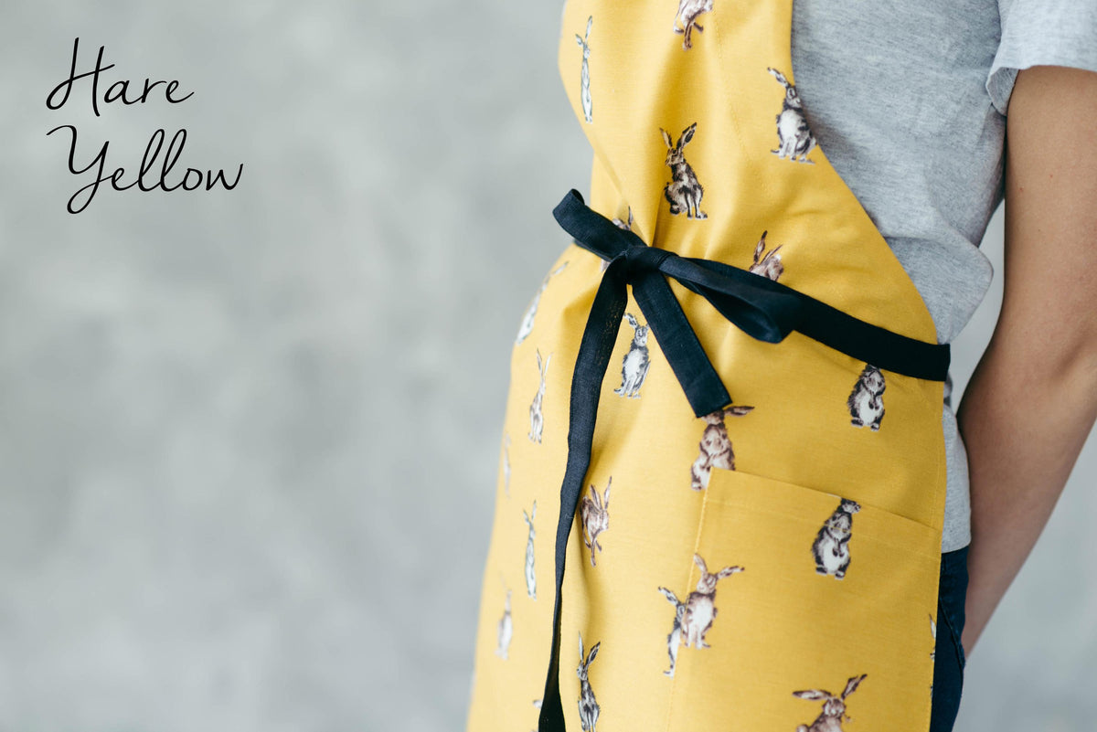 Bunny print kids apron worn by a child
