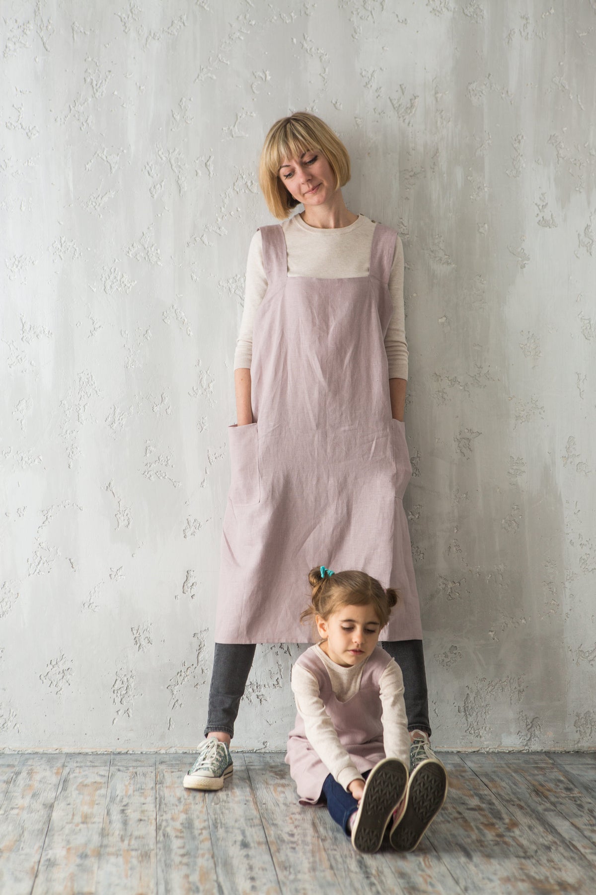 Matching linen pinafore aprons for mother and child in pale pink