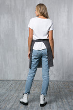 Grey linen waist apron worn by a barista