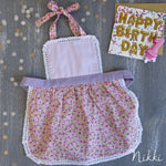 Kids lace apron worn by a toddler