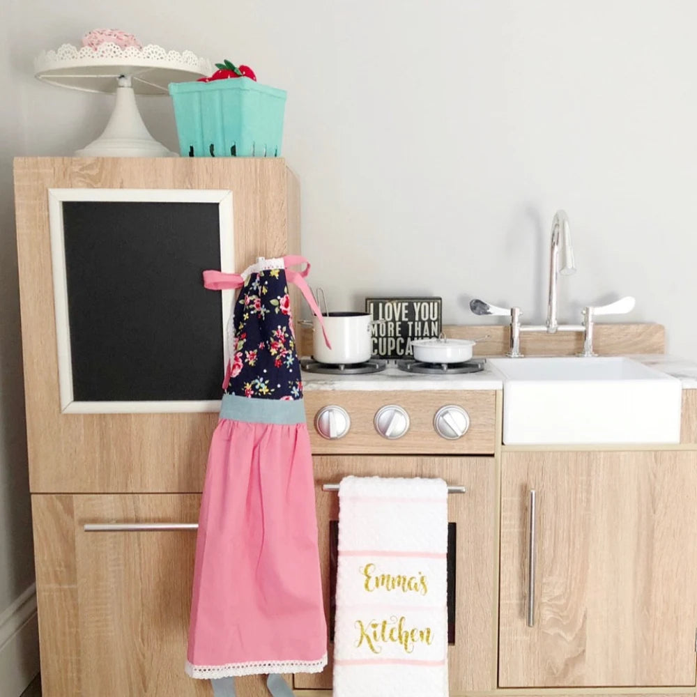 Pink kids lace apron, front view