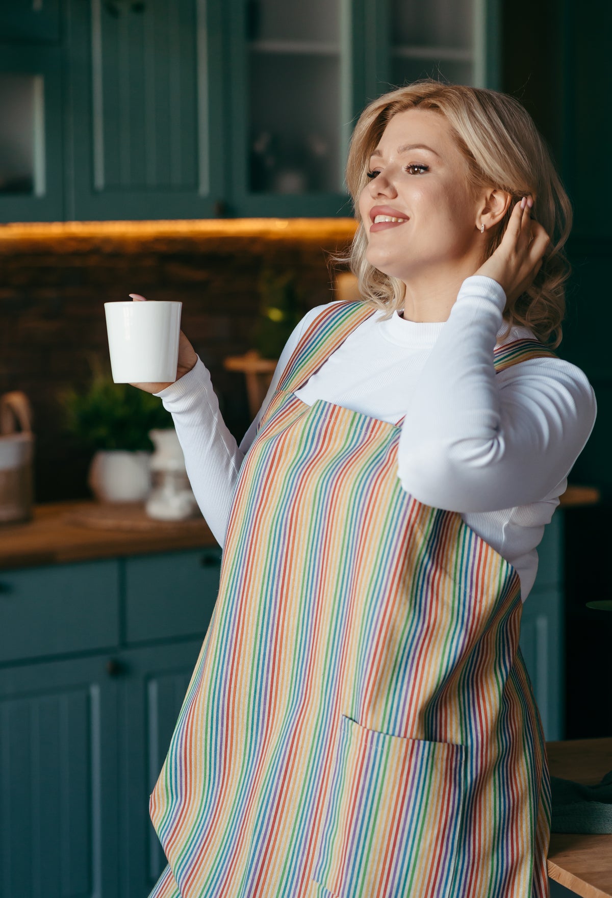 Rainbow stripe linen pinafore apron, back view showing crossover straps