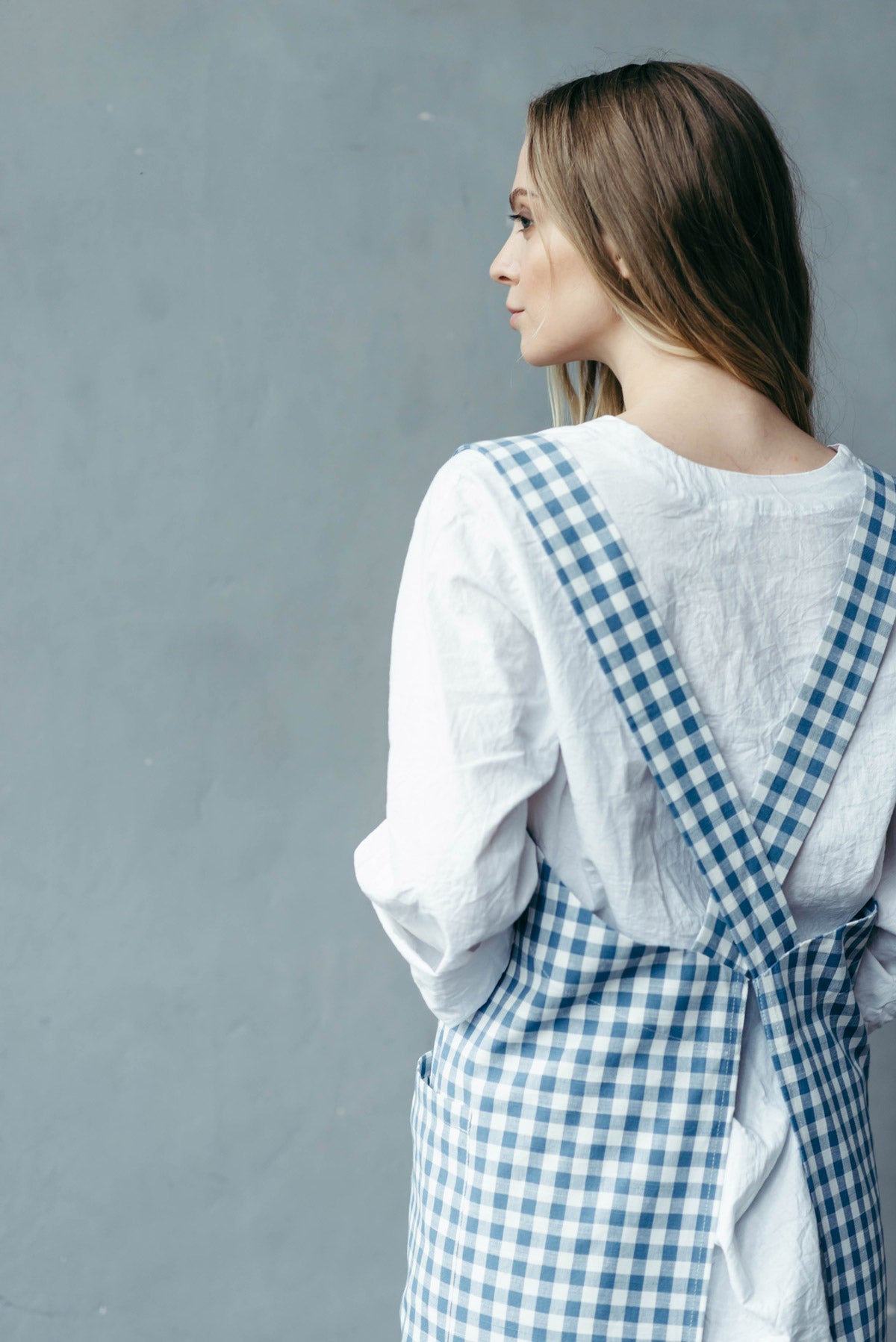 Checked cross back apron, strap detail